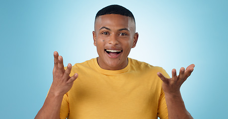 Image showing Young man, wow and excited face for news in studio with college announcement, results or learning opportunity. Happy portrait of student in surprise, shock or questions for college on blue background