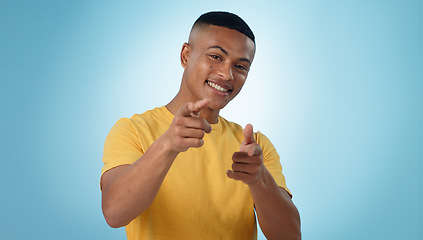 Image showing Happy man, portrait and pointing to you for choice, selection or hiring against a blue studio background. Male person or model and finger for decision, choose or opportunity in recruiting on mockup