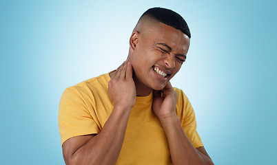 Image showing Neck pain, stress and man in studio with burnout, musical or joint crisis on blue background. Shoulder, injury and face of male model with anxiety for arthritis, fibromyalgia or osteoporosis tension