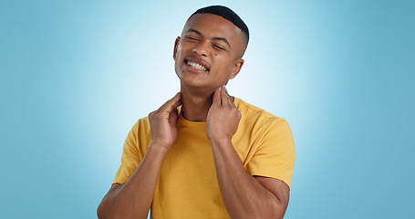 Image showing Stress, neck pain and man in studio with burnout, muscle or joint crisis on blue background. Shoulder, injury and face of male model with anxiety for arthritis, fibromyalgia or osteoporosis tension