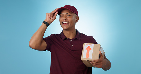 Image showing Greeting, shipping box or portrait of delivery guy in studio with courier service or supply chain package. Happy man, blue background or worker with safe cargo for mail distribution or post services