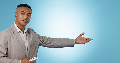 Image showing Weather forecast, portrait or man talking with hands for mockup space on blue background. Reporter, anchor or presenter in broadcast for presentation, climate change prediction or news in studio