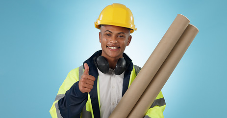 Image showing Engineering, man and thumbs up for architecture success, renovation and design planning with blueprint in studio. Portrait of construction worker or contractor with like emoji on a blue background