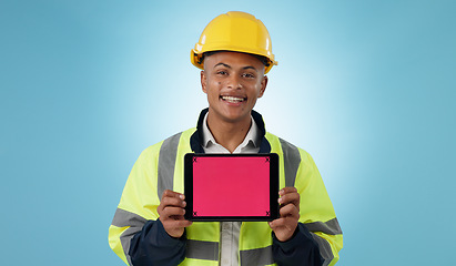 Image showing Engineering man, tablet screen and mockup for industrial presentation of renovation, architecture or design in studio. Portrait of construction worker with digital tracking markers on blue background