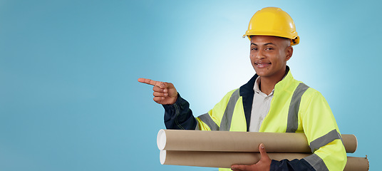 Image showing Man, construction worker and pointing with building plans, safety wear and architect on studio background. Professional, mockup space and industrial blueprint for engineering project, builder and job