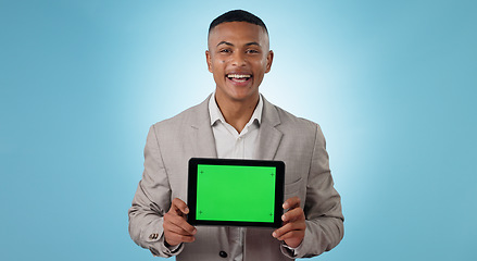 Image showing Business man, tablet green screen and advertising for website space, information or trading software in studio. Portrait of trader with digital mockup, space and tracking markers on a blue background