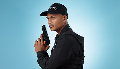Image showing Man, security guard and holding gun for shooting, protection and hands with face, portrait or confident. Safety, service or weapon for criminal, law or studio background for pistol, crime or eyes
