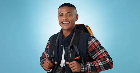 Image showing Man, portrait or backpack in studio or adventure hiking, mockup space on blue background. Black person, face or smile for camper explorer or fitness journey for discover, vacation or travel trekking