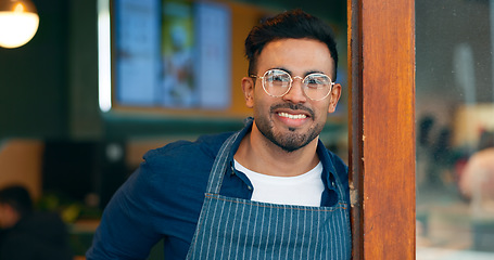 Image showing Portrait, entrance and happy man, restaurant business owner or coffee shop manager smile for cafeteria service. Hospitality, management and confident barista, waiter or server leaning on cafe door