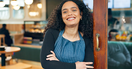 Image showing Small business, coffee shop and arms crossed with smile, waitress and startup for cafe, entrance and restaurant. Portrait, woman and manager for retail, proud and confident at store, happy and open