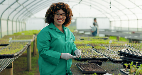Image showing Woman, greenhouse and portrait with gardening and agriculture work with a smile of food farmer. Sustainability, plants and soil with agro career and farming with produce and growth inspection