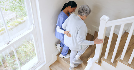 Image showing Nurse, senior woman and support on stairs, help and walk in nursing home. Caregiver, assistance on steps and elderly patient with a disability, injury or sick in rehabilitation for medical healthcare