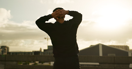 Image showing Back, sunset and man with fitness, exercise with progress, challenge and workout with wellness, calm and peace. Person, athlete and runner in the city, training and healthy with activity and hobby