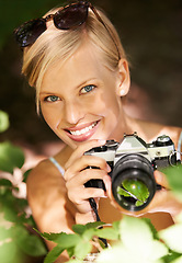 Image showing Portrait, photographer and nature with woman in forest for trees, environment and relax. Shooting, camera lens and photography with face of female person in woods for travel, torusim and summer