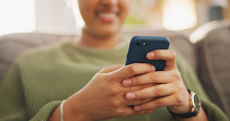 Image showing Home phone, hands typing and woman relax, connect and search online website, omnichannel and post to mobile app. Lounge couch, smartphone scroll and person reading social media blog, article or email