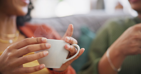 Image showing Lgbtq couple, coffee and women on sofa in home for bonding, connection and relax together. Love, lesbian date and hands of people drinking tea in living room for chatting, social visit and talking