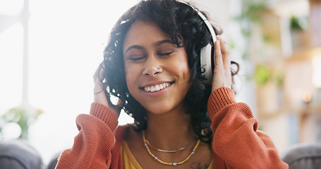 Image showing Home, dance and woman with headphones, music and motivation with audio, streaming radio and listen. Person on a couch, girl and lady with headset, energy and song with freedom, wellness and happiness