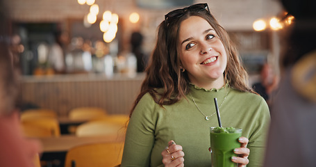 Image showing Girl friends, talk and smoothie in cafe, green drink and happy for health, nutrition and juice with smile. Gen z woman, milkshake or diet with group, students and chat in restaurant, diner and cafe