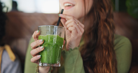 Image showing Smoothie, drink and hands of woman in restaurant with healthy, green tea or cocktail of juice with fruits and vegetables. Drinking, matcha or girl in vegan coffee shop with liquid fruit or nutrition