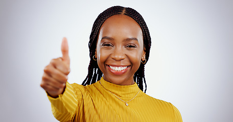 Image showing Thumbs up, woman and portrait in studio for success, winning deal and happy achievement on white background. African model, emoji and like sign for feedback, voting yes and thank you for excellence