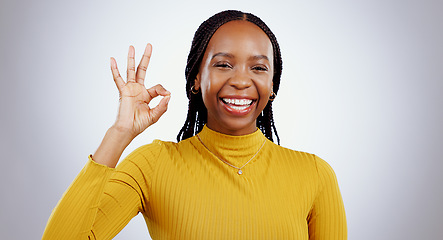 Image showing Portrait, smile and black woman with perfect hand in studio for feedback, support or motivation on grey background. Ok, emoji and face of lady model with vote success, thank you or review excellence