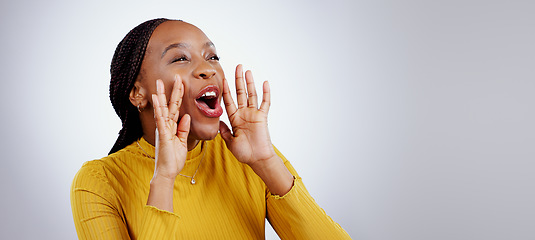 Image showing News, announcement and happy black woman shouting in studio for coming soon, deal or info on grey background. Screaming, excited and female model with emoji for giveaway, sale or sign up motivation