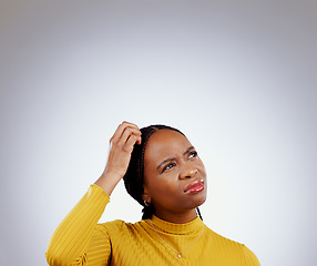 Image showing Thinking, solution and black woman in a studio with memory, brainstorming and planning facial expression. Guess, question and young African female model with confused face isolated by gray background