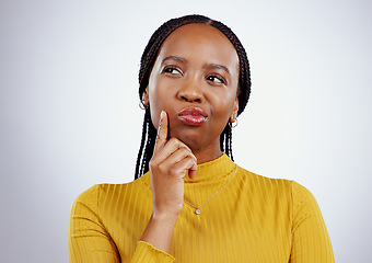 Image showing Thinking, guess and black woman in a studio with memory, brainstorming and planning facial expression. Guess, question and young African female model with a confused face isolated by gray background.