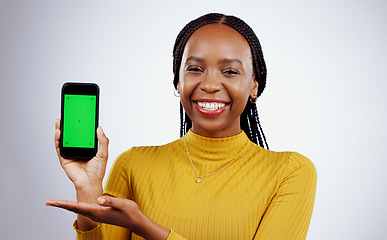Image showing Woman, phone and green screen of marketing mockup, presentation and happy news on a white background. Face of african person on mobile app, design space and opportunity with tracking marker in studio