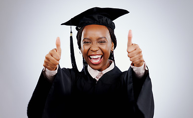 Image showing Graduation cap, woman and thumbs up for study success, celebration and education, learning or college in studio. Portrait of excited African graduate or student with like emoji on a white background