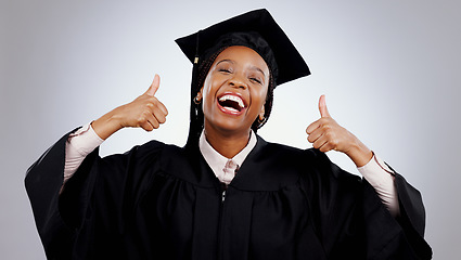 Image showing Graduation, woman and student thumbs up for study success, celebration and education, learning or college in studio. Portrait of excited African graduate with yes and like emoji on a white background