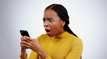 Image showing Woman, reading phone and shocked for news, social media and online error or mistake on a white background. African person confused, surprise and stress on mobile for scam or notification in studio