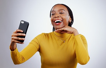 Image showing Studio, happy or black woman taking selfie on social media with confidence, post or smile online. African lady, memory or face of influencer taking a photograph, vlog or picture on grey background