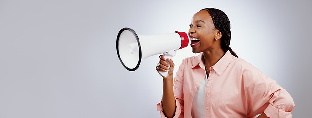 Image showing Happy woman, megaphone and voice for announcement, broadcast or news of sale or discount on white background. African person with attention, noise and broadcast of winner in studio and banner space