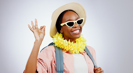 Image showing Sunglasses, black woman and ok hands for perfect, portrait and studio isolated on white background mockup. Face, smile or person with okay sign, gesture and hat for travel or vacation recommendation
