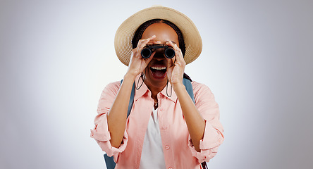 Image showing Woman, binocular or smile in studio for travel, hiking or sightseeing with backpack on gray background. Black person, telescope lens or happiness for search, adventure and experience on mock up space