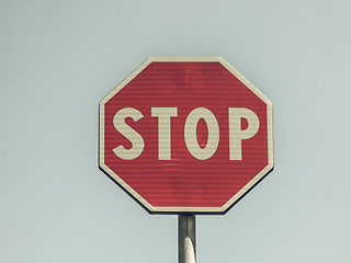 Image showing Vintage looking Stop sign over blue sky