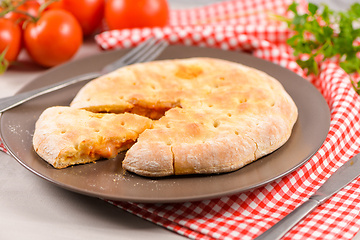 Image showing Pizza calzone on wooden background