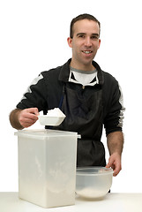 Image showing Man Measuring Flour