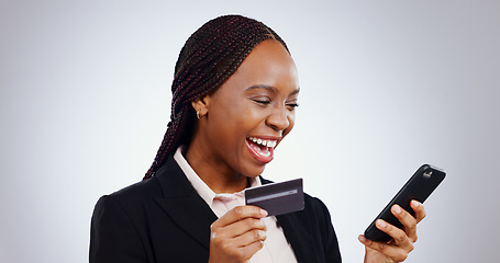 Image showing Business woman, credit card and phone for online shopping, e commerce success or financial loan in studio. Professional african winner on mobile for internet banking and payment on a white background