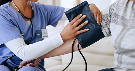 Image showing Caregiver hands, home and blood pressure test for healthcare service, support and nurse for medical monitor. Doctor with patient arm and helping with diabetes or hypertension exam on sofa and machine