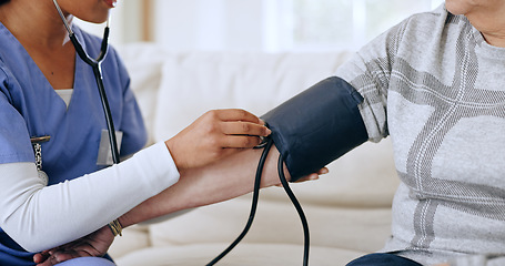 Image showing Nurse hands, home and blood pressure test for healthcare service, support and caregiver for medical monitor. ADN worker or doctor with patient arm, stethoscope or helping in hypertension exam on sofa