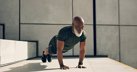 Image showing Mature, man and fitness for exercise with pushup for strength, health or wellness by outside. African person, alone and training near stairs for workout with endurance, concentration and dedication