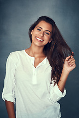 Image showing Woman, happy and portrait or pose, hair and backdrop for fashion, style and proud or confident. Female person, beauty and haircare for cosmetics, glow and cool or retro, trendy and vintage clothing