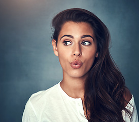 Image showing Woman, funny face and fashion in studio, pose and mockup by background, stylish and cool clothing. Female person, pout and beauty or cosmetics, emoji and trendy in aesthetic, goofy and silly by space