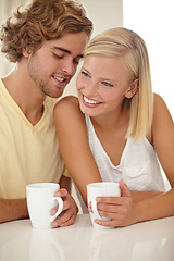 Image showing Couple, coffee and table smile in morning for breakfast drink, marriage whisper, together or conversation. Man, woman and cup for love latte for weekend connection, relax bonding or peace in kitchen