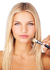 Image showing Makeup, brush and portrait of woman in studio for application, foundation or cover on white background. Beauty, makeover or face of female with hands of beautician for professional, powder or contour