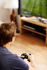 Image showing Man, video game and home with tv, controller or back to relax with online competition in living room. Gamer person, playing or contest with click for strategy, streaming or digital challenge in house