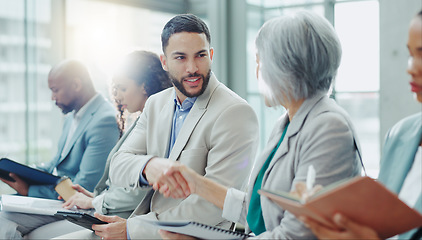 Image showing Business people, handshake and meeting in seminar greeting, introduction or teamwork at office. Businessman shaking hands with woman in staff training, team workshop or recruiting deal at workplace