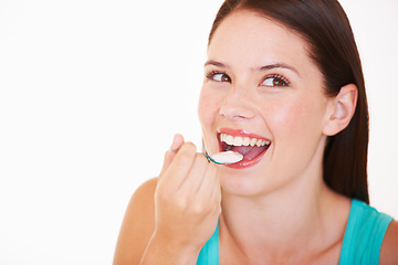 Image showing Eating, yogurt and portrait of woman with healthy food, diet or nutrition in studio with happiness. Happy, face and girl with spoon, yoghurt and strawberry flavor of dairy, product or snack for lunch